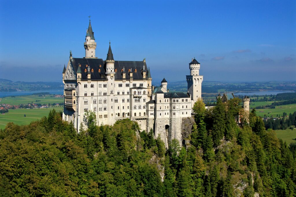 German Road Trip Itinerary - view of Neuschwanstein Castle from the mountains
