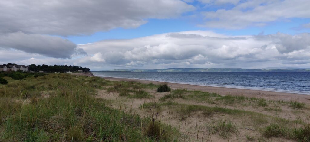 Views across the sandy dunes to the ocean, from Nairn, during our Scottish Highlands Road Trip
