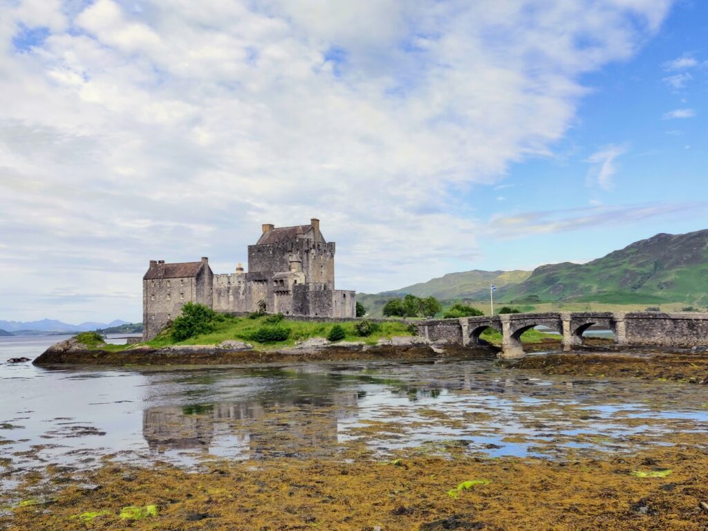 Eilean Donan Castle from across the river on a sunny day on our Scottish Highlands road trip