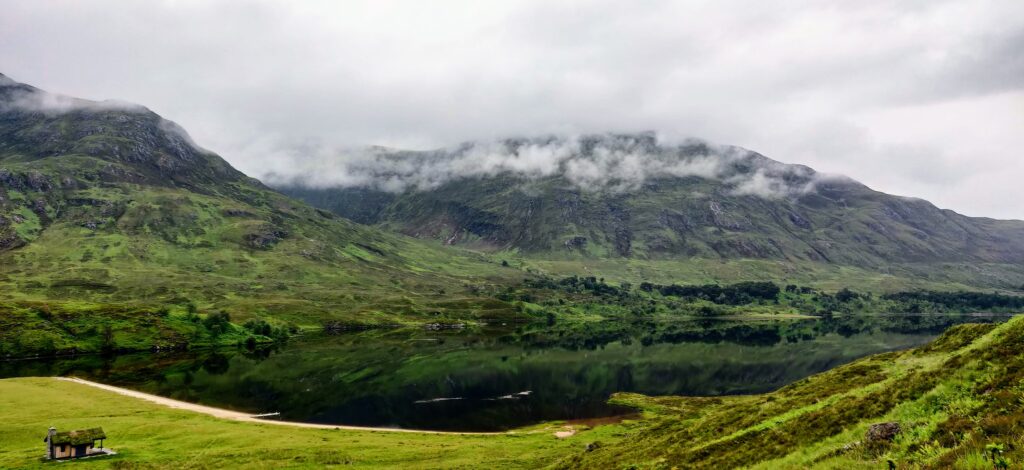 View across Loch Affric during our 10 Days in Scotland, admiring the cloud covered mountain peaks overlooking the loch