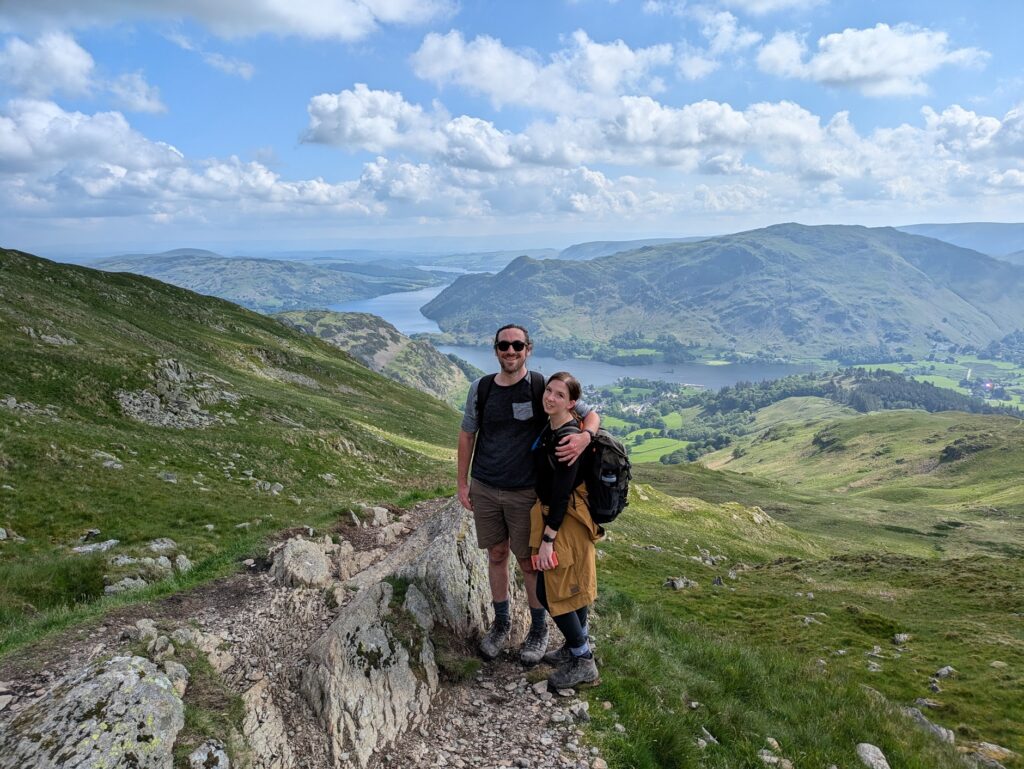 Hiking Helvellyn via Striding Edge - taking in the views over Ullswater