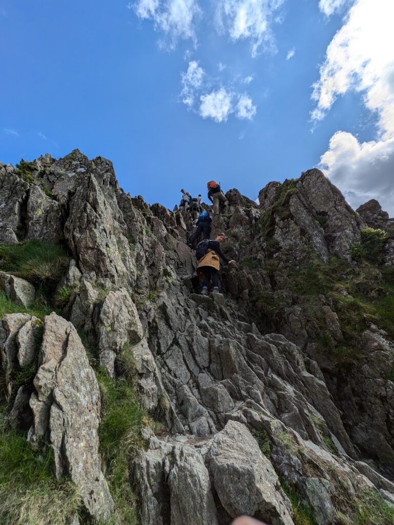 Hiking Helvellyn via Striding Edge - climbing down the chimney