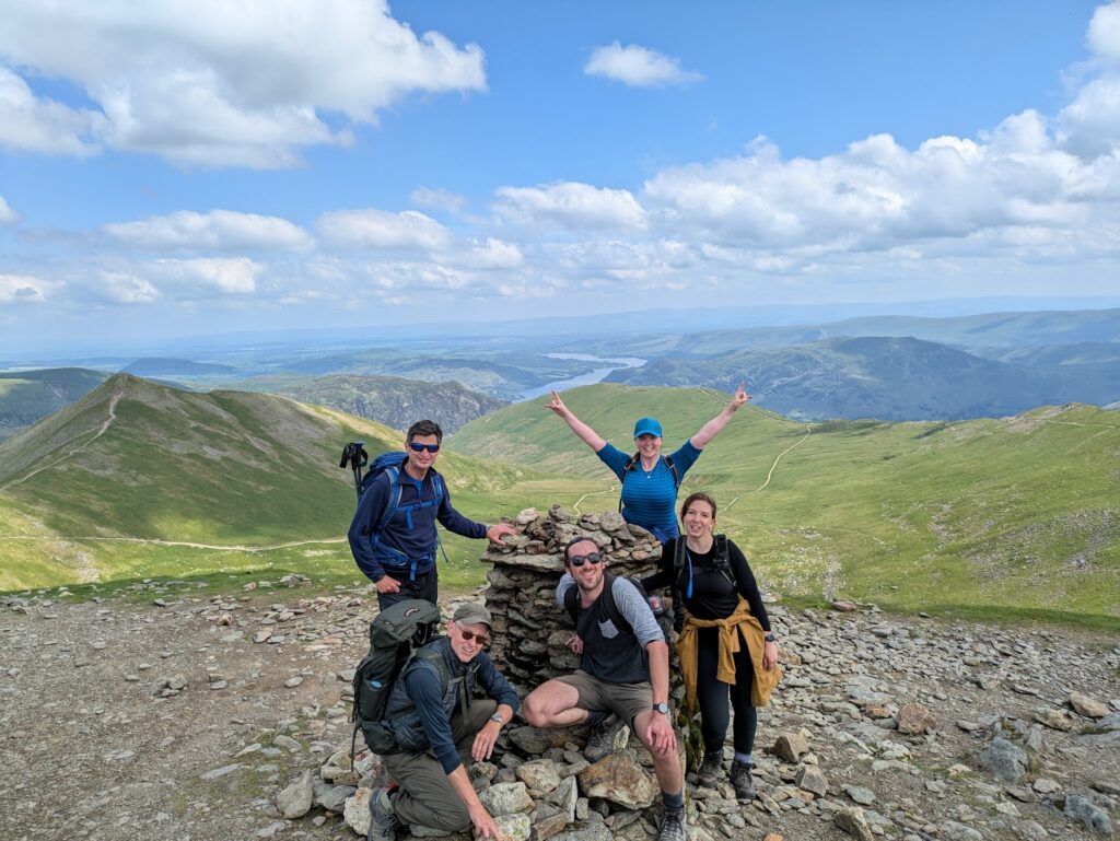 Hiking Helvellyn via Striding Edge - standing at the summit